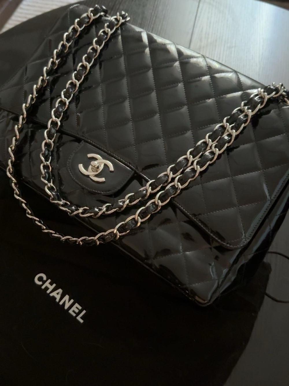 CHANEL Black Quilted Patent Leather Shoulder Bag with Silver Chain